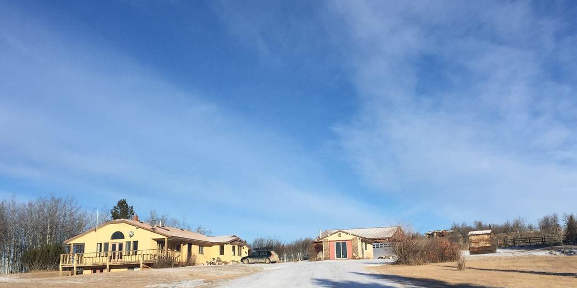 Snowy lane and big sky at the InStep Centre property